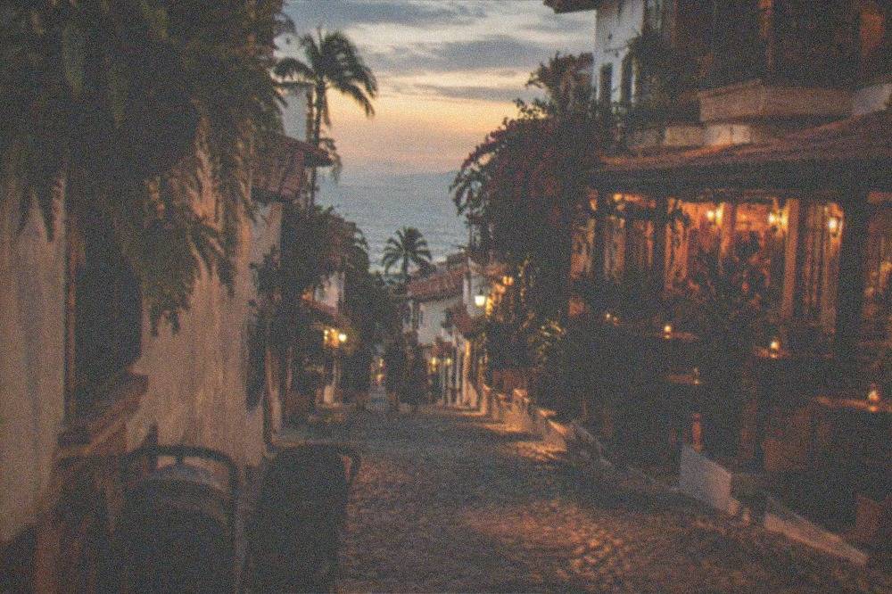 Evening street in Zona Romantica with lit restaurant fronts and people strolling