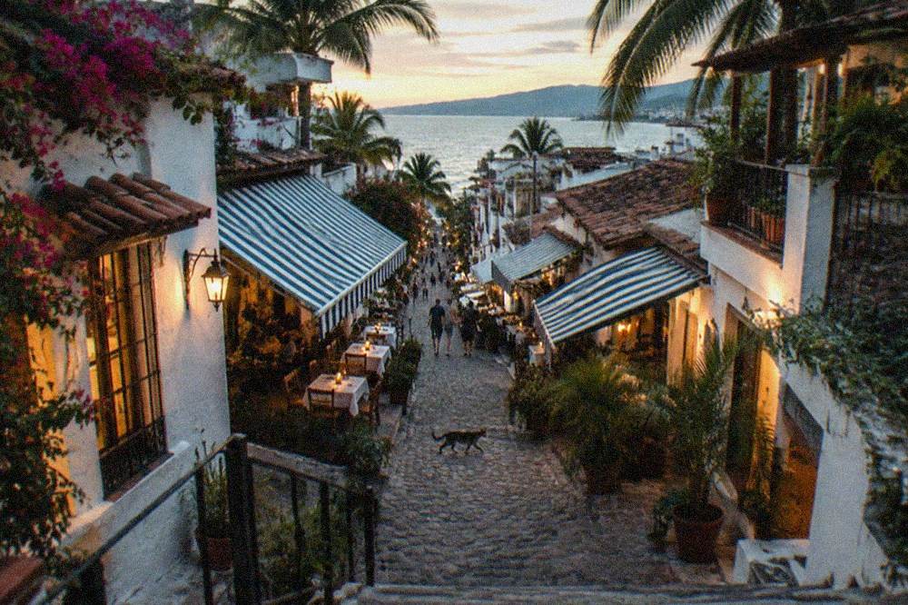 Cobblestone restaurant street in Zona Romantica with awnings and evening light